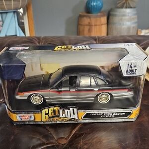 Black and Silver Ford Crown Victoria Model Car